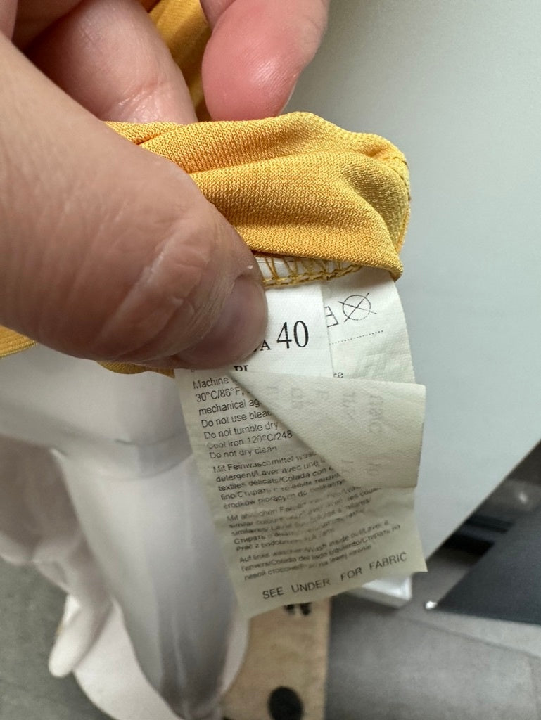 Taifun mouwloze col maat 40 geel