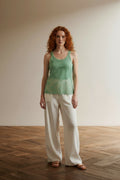 Full body view of the model wearing Twin-Set Simona Barbieri mintgroene kanten top maat L – made in Italy