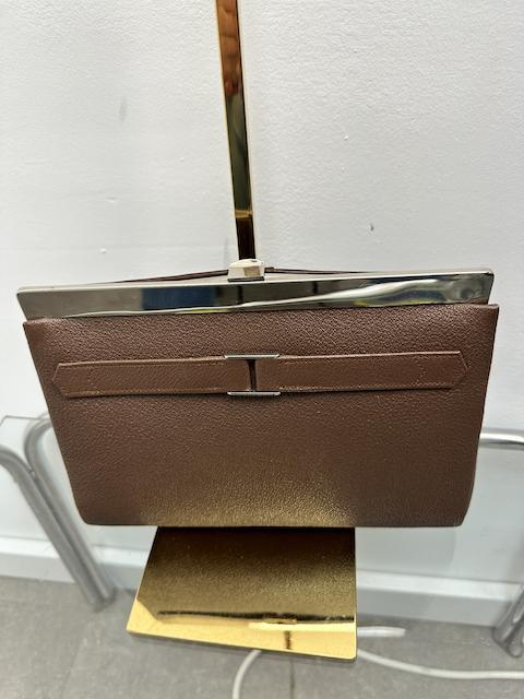 Bruine vintage avondtas met gouden accenten
