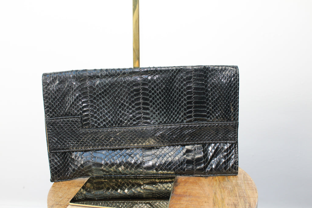 Vintage zwarte clutch met slangenprint
