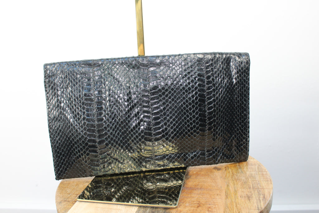 Vintage zwarte clutch met slangenprint