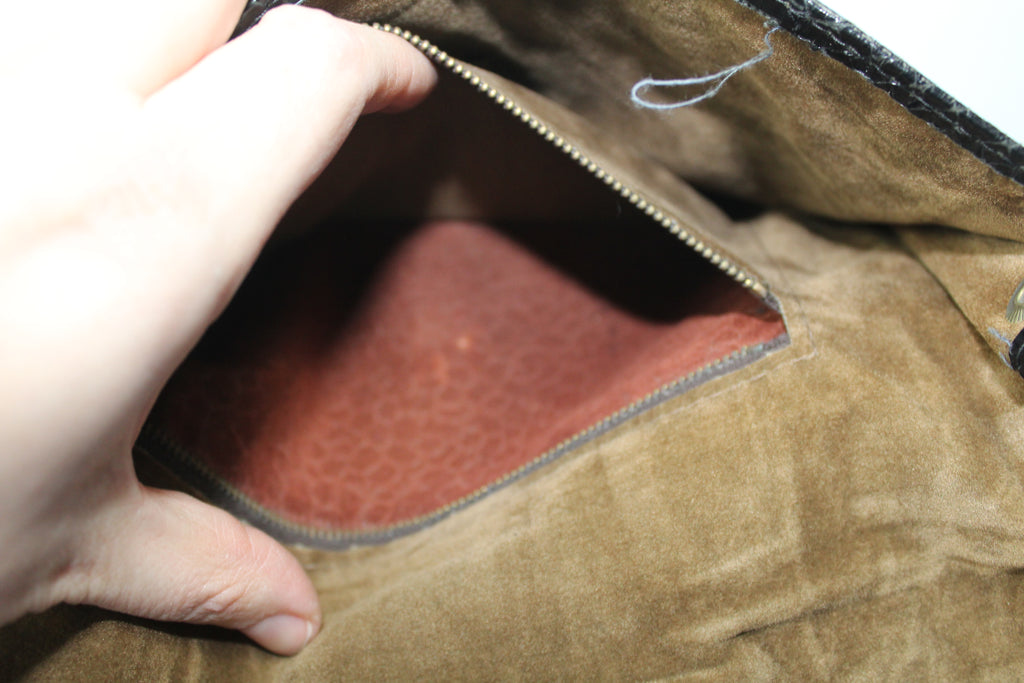 Vintage zwarte clutch met slangenprint